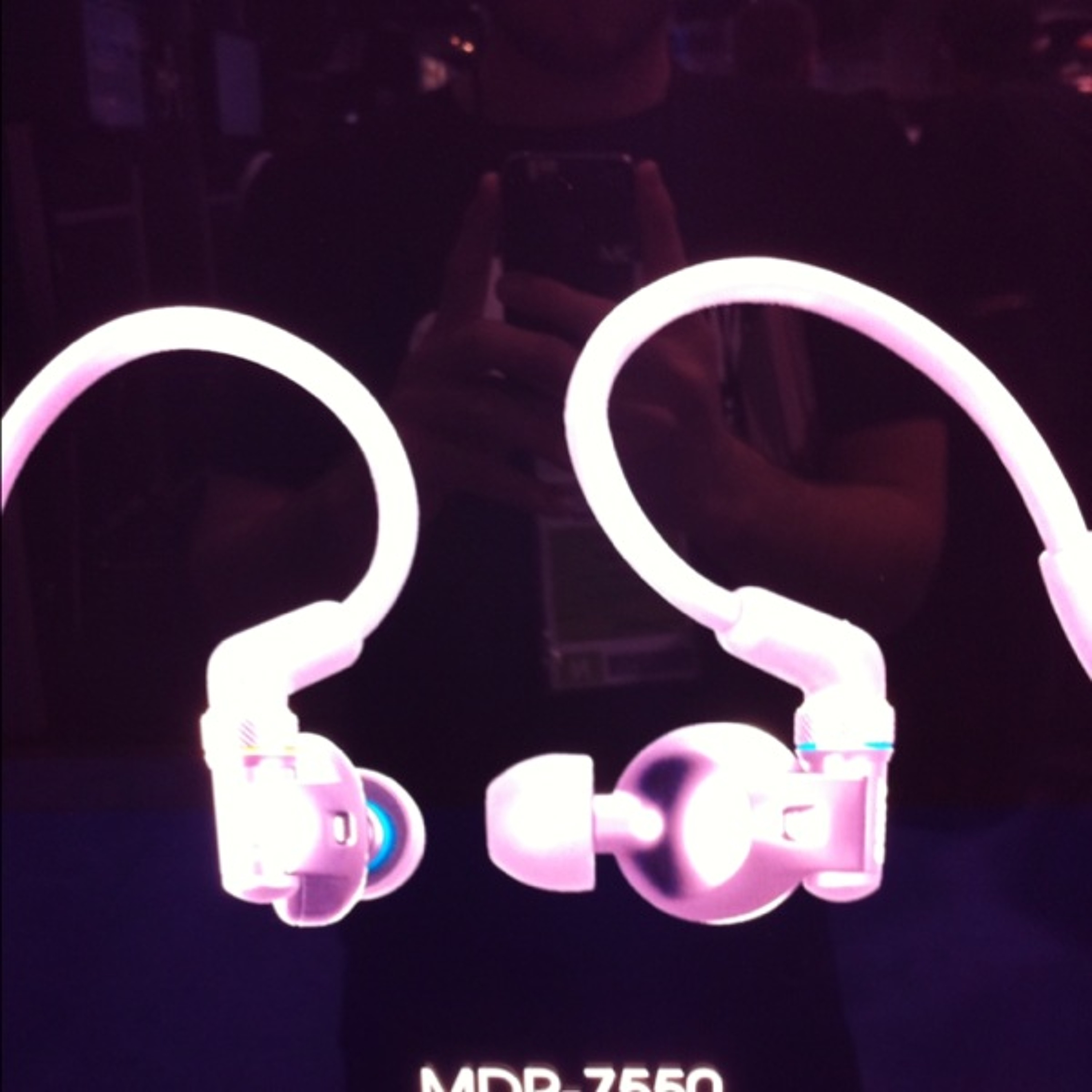 Tall oakly guy wt headset and hotpants  at Winter NAMM Show on Saturday morning episode artwork