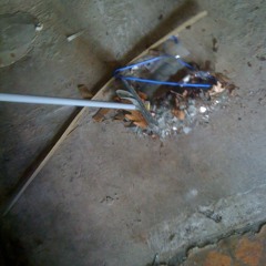 sweeping broken glass with a busted metal mop