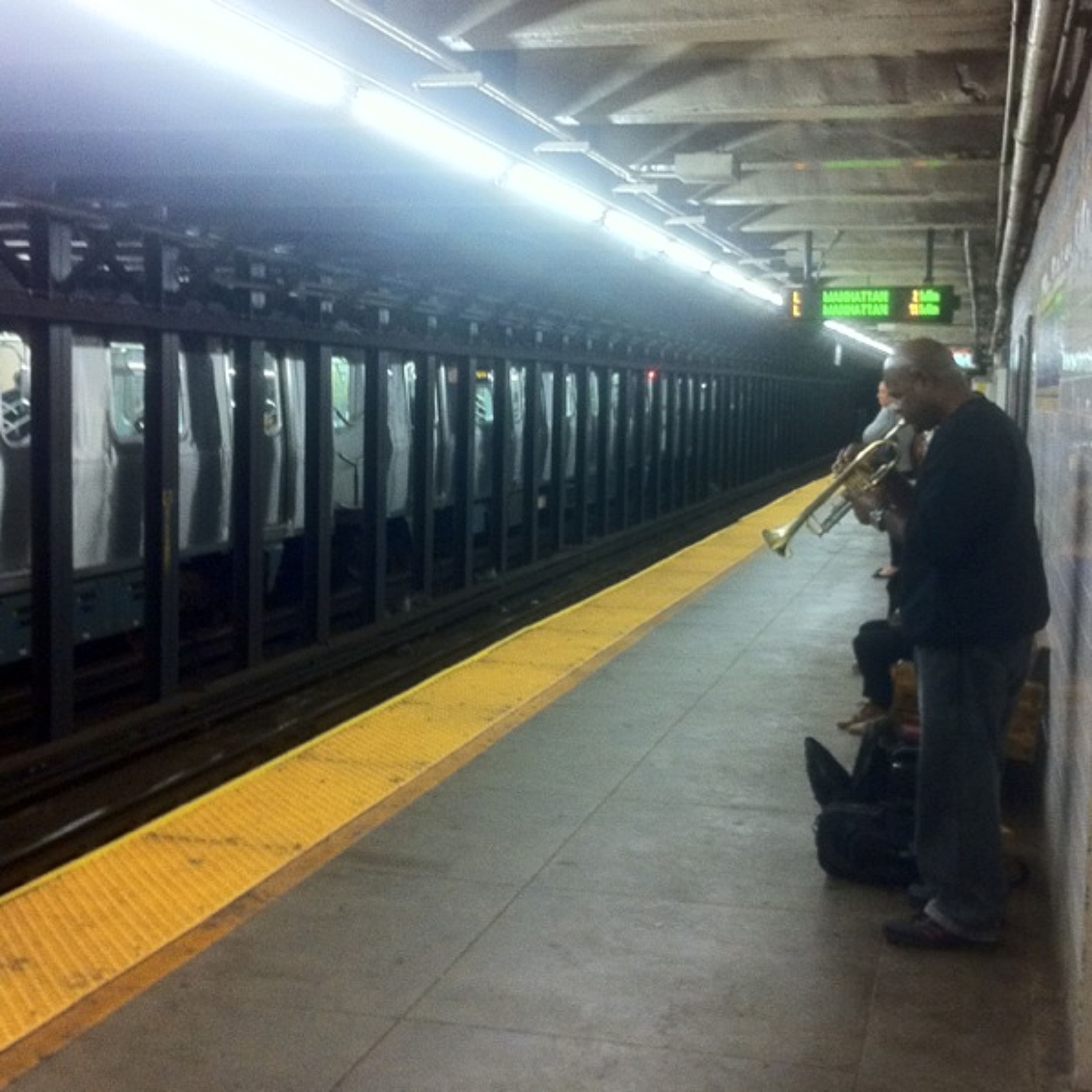 Busker at Graham Ave stop episode artwork