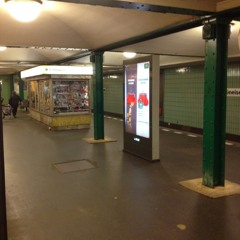 Woman with headphones singing in the underground at Berlin, naturally.