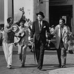 The man in the long black coat