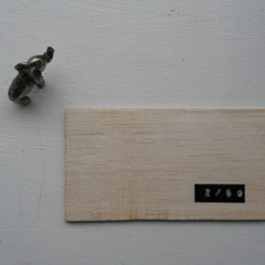 a small, flat rectangle of balsa
