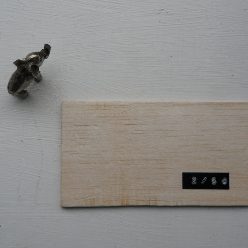 a small, flat rectangle of balsa