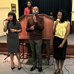 Singing during praise and worship at church (trio)