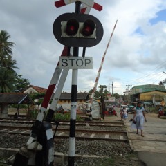Rail crossing warning bell and train passing