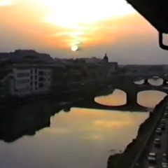 Sunset, standing at the balcony with a glass of whiskey