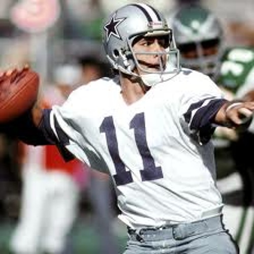 Dallas Cowboys quarterback Danny White (11) rolls out for a pass in action  against Tampa Bay at Texas Stadium, Sept. 22, 1980. White completed 24 of  33 passes for 244 yards in