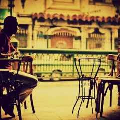 مقهي وانت مع الجريدة جالس - محمود درويش