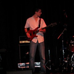 Twan playing some acoustic guitar with 5 of 6 strings On New Year's eve 2014.