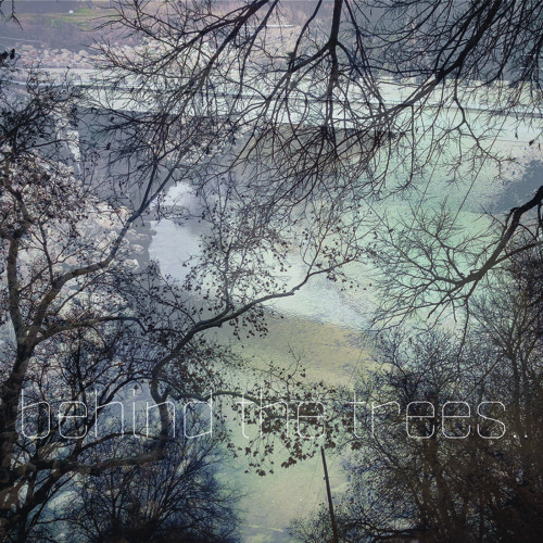 behind the trees