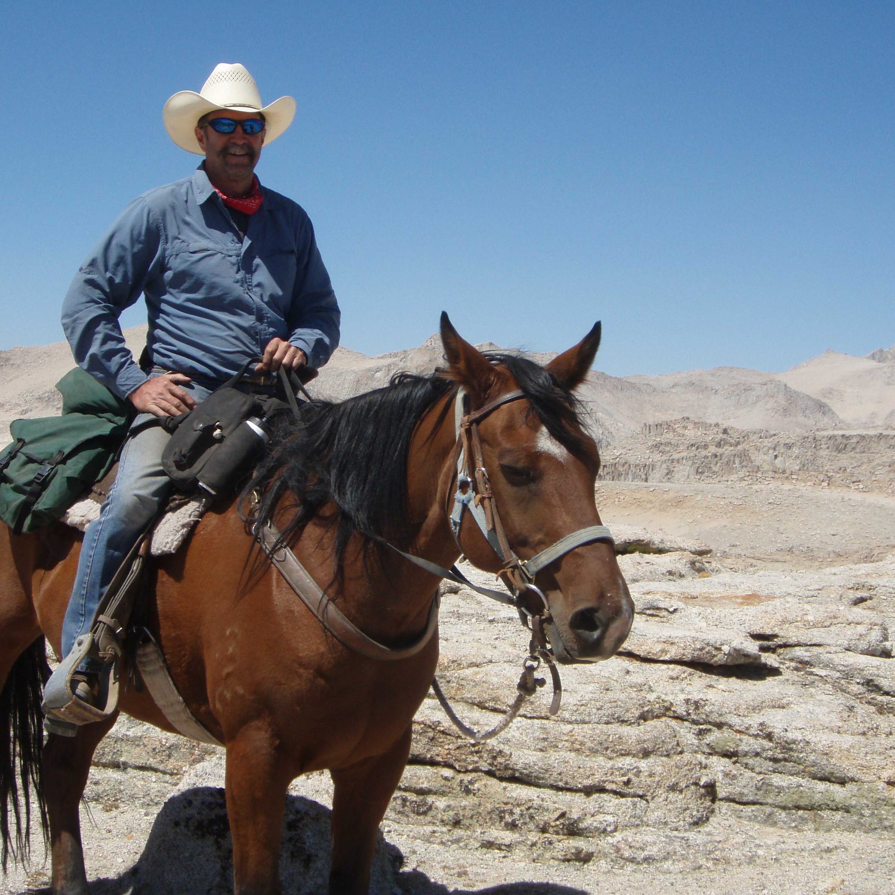 Ranger JD Swed, a flathat, and a horse