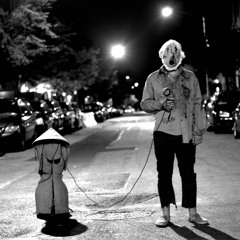 The Man With The Shoes In His Hands