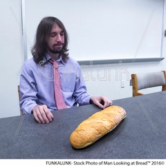 Stock Photo of Man Looking at Bread