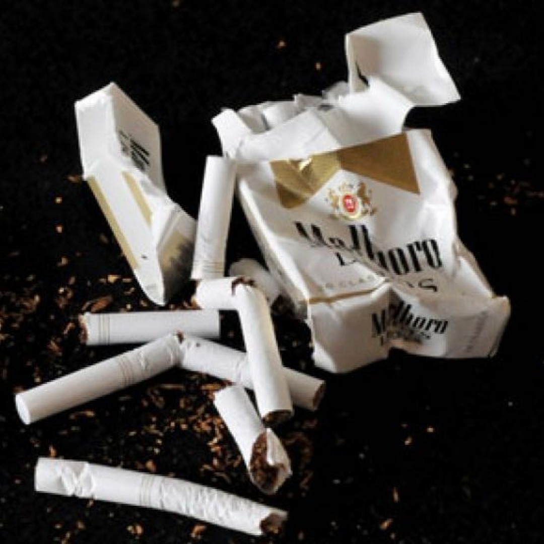crushed cigarette Closeup Of A Mans Hand With Cigarettes High-Res Stock Photo 1 inch 3 inch Tall Iron Several Used Cigarette Butts Crushed