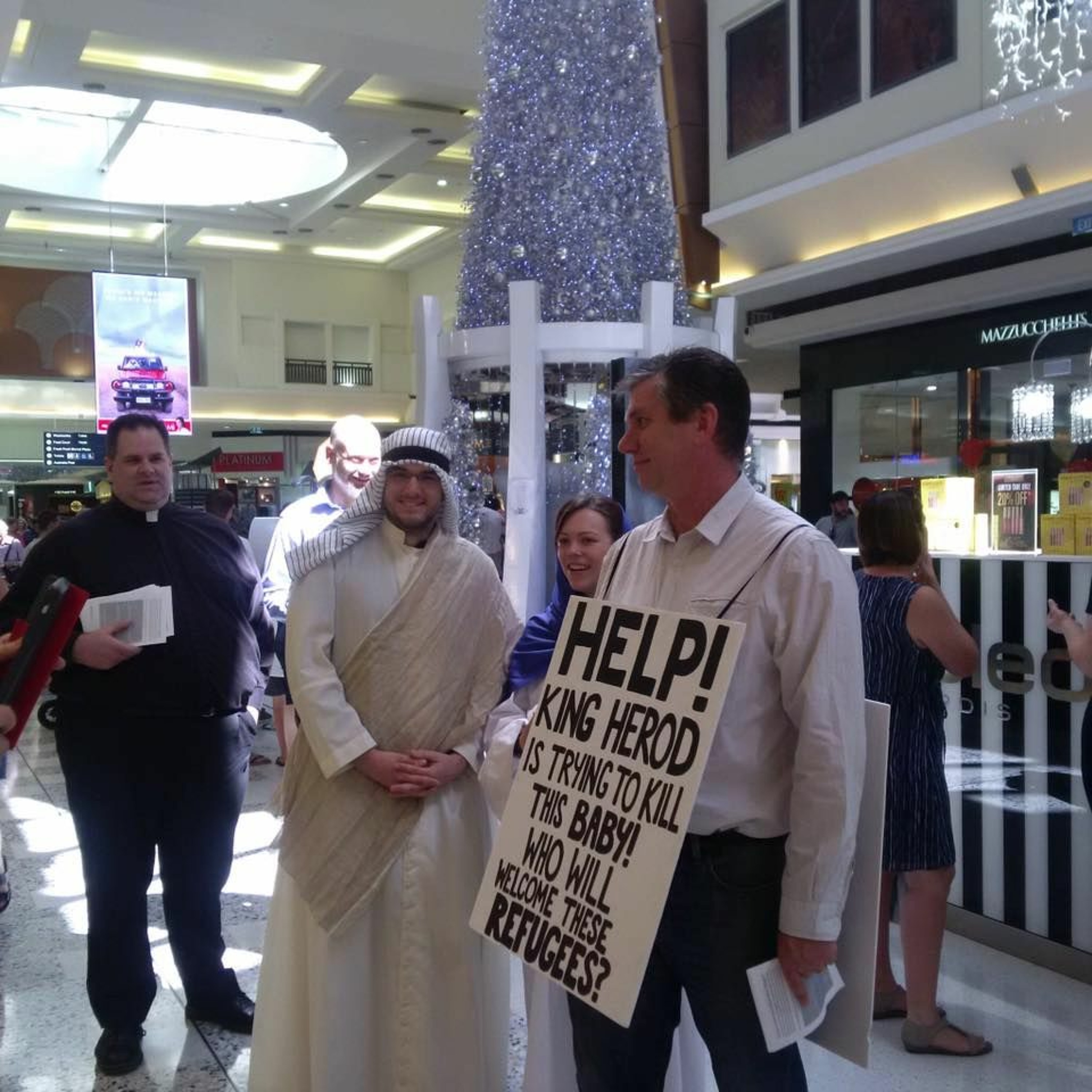 Father Chris Bedding & Holy Family greet shoppers at Garden City episode artwork
