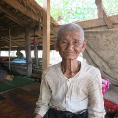 កួយច្រៀងអង្គួច (ភូមិអូរពោធិ៍ / រំចេក 1970 by Bernard Dupaigne)