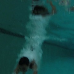 miraculously, she pulls herself out of the water