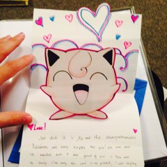 Pokemon Cards And An Empty Bottle Of Grape Juice