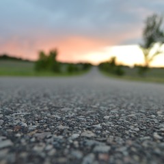 Lights fading on the blacktop.