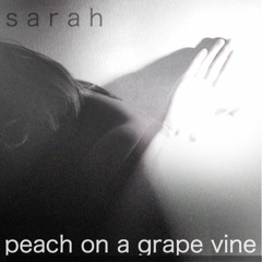 peach on a grape vine