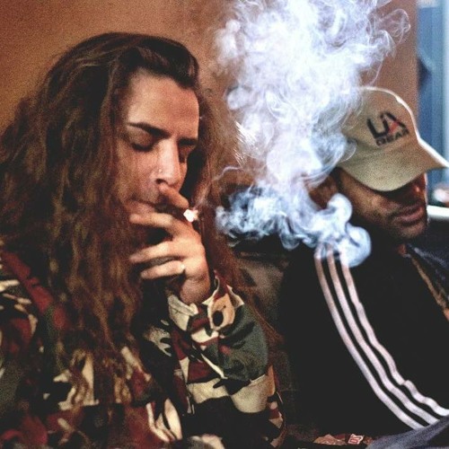 Yung Pinch smoking a cigarette (or weed)
