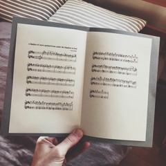 a blanket of snow spotted from under the blankets in bed (piano version)