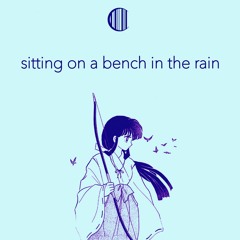 sitting on a bench in the rain
