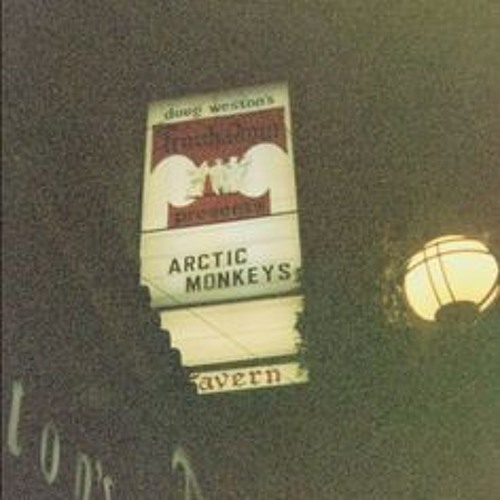 arctic monkeys played through a vintage radio in the rain