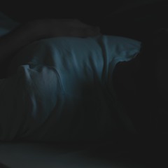 Lonely boy on his bed (Thinking about loneliness)