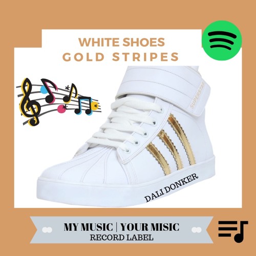white shoes with gold stripes