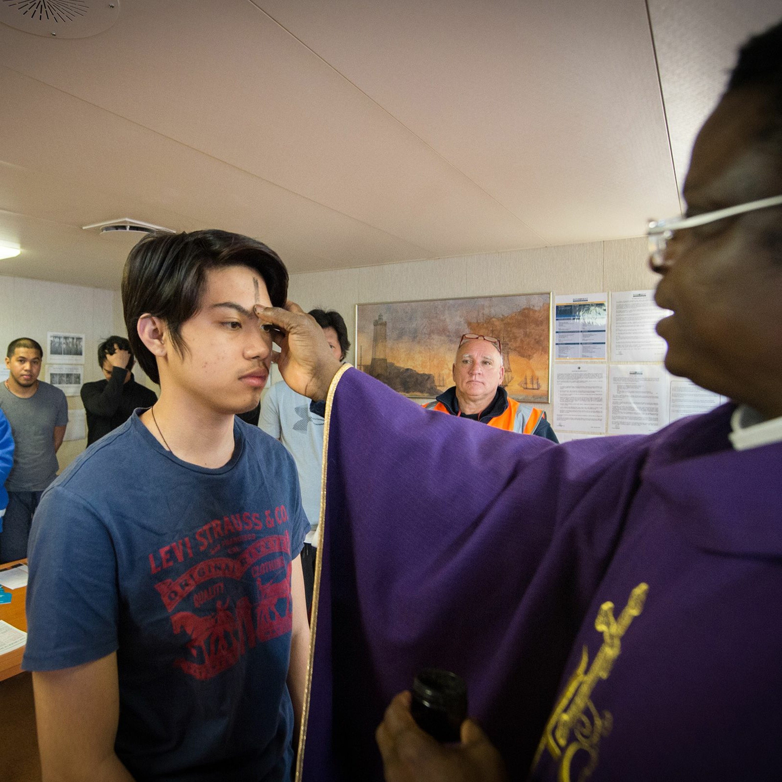 Celebrating Ash Wednesday Mass on a large shipping vessel episode artwork