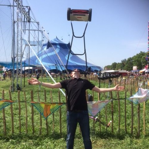 Jay Rawlings tries to break a world record by balancing a lawnmower on his chin!