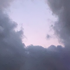 night drive moon is high sky is bright with city lights