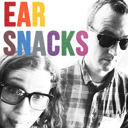 The cover art for Earn Snacks. The two hosts are photographed in black and white, with the title in multicolored all-caps sans-serif text.