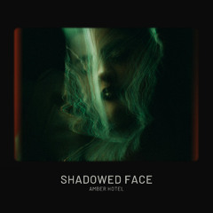 Amber Hotel - Shadowed Face