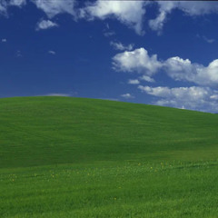 A Town With Green Grass and Blue Skies