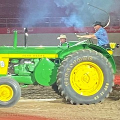 Pulling their weight: Tractor pullers shine at Calgary Stampede