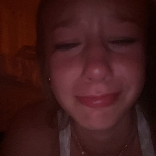 probably crying over a boy