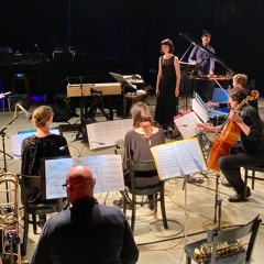 kO[h] for female singer/performer and ensemble