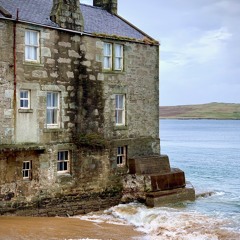 Waves crashing on beach on Shetland Island Scotland