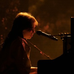 Billie Eilish playing the piano