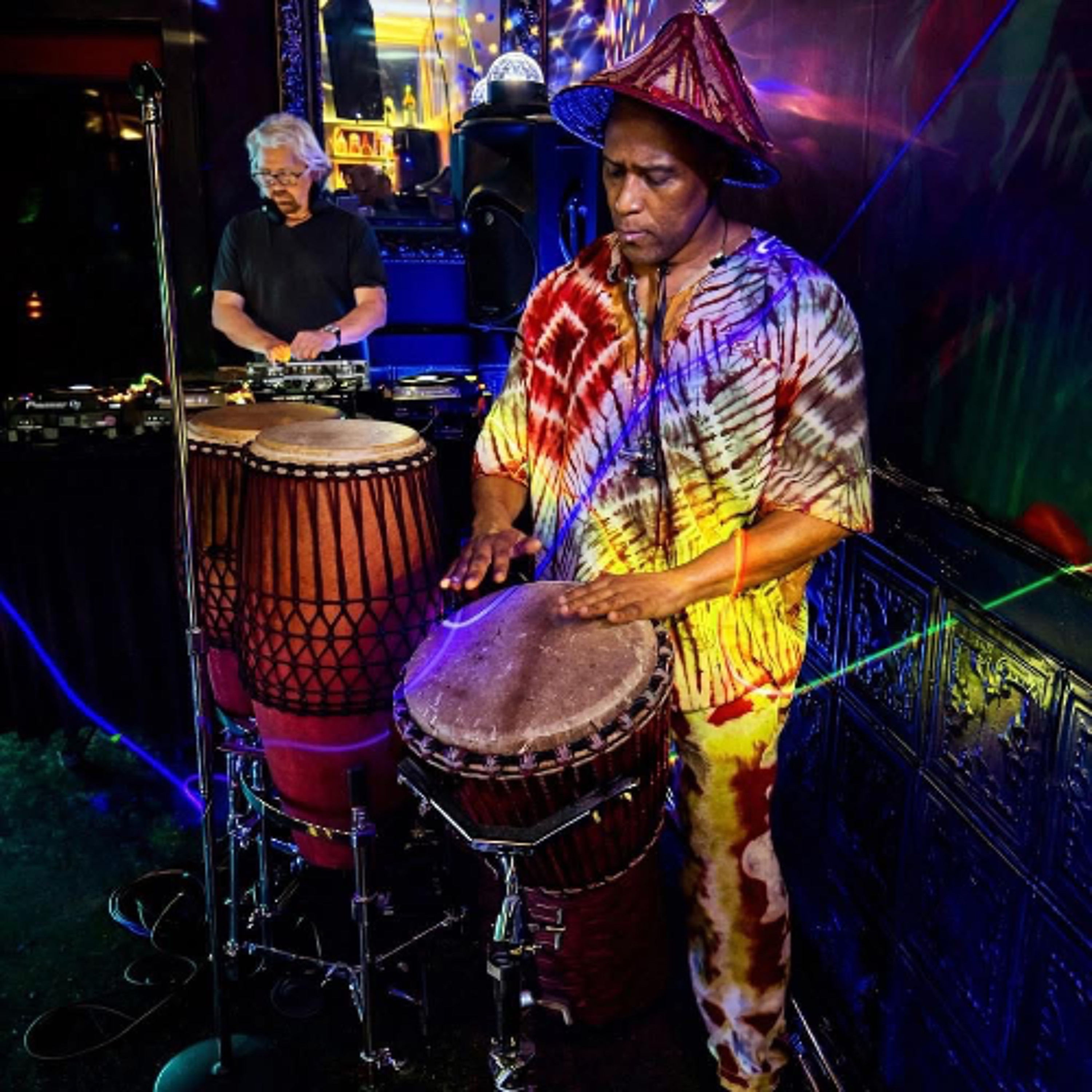 Volume 33: AFRICANISM Branca room with guest percussionist, S-Ankh episode artwork