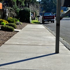 Silhouettes On The Sidewalk