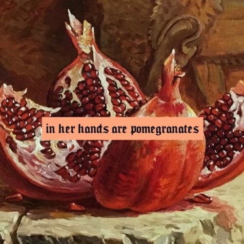 in her hands are pomegranates