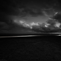 under a black cloud