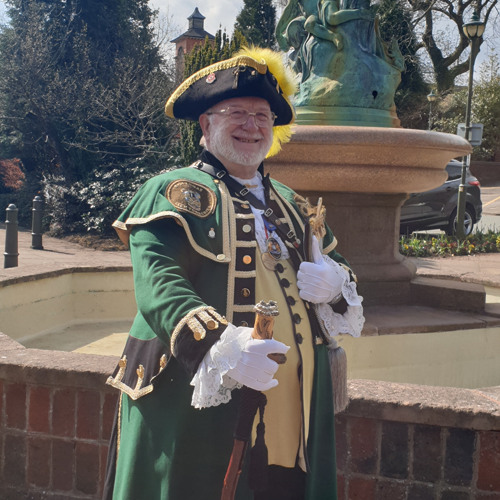 Leek town crier, Bill Lomas welcomes the town back to life