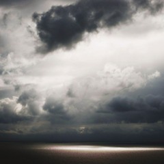 The sky unfurls its gray blanket