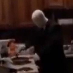 holy shit is that the slender man?!? and he is cooking hotdogs on the stove??