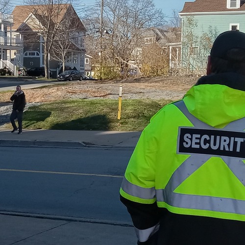 University security confront man after he shouts at students for wearing masks