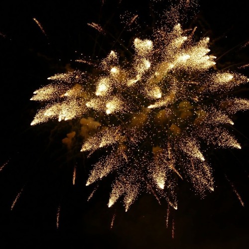 New Year's rockets in low clouds and light snowfall